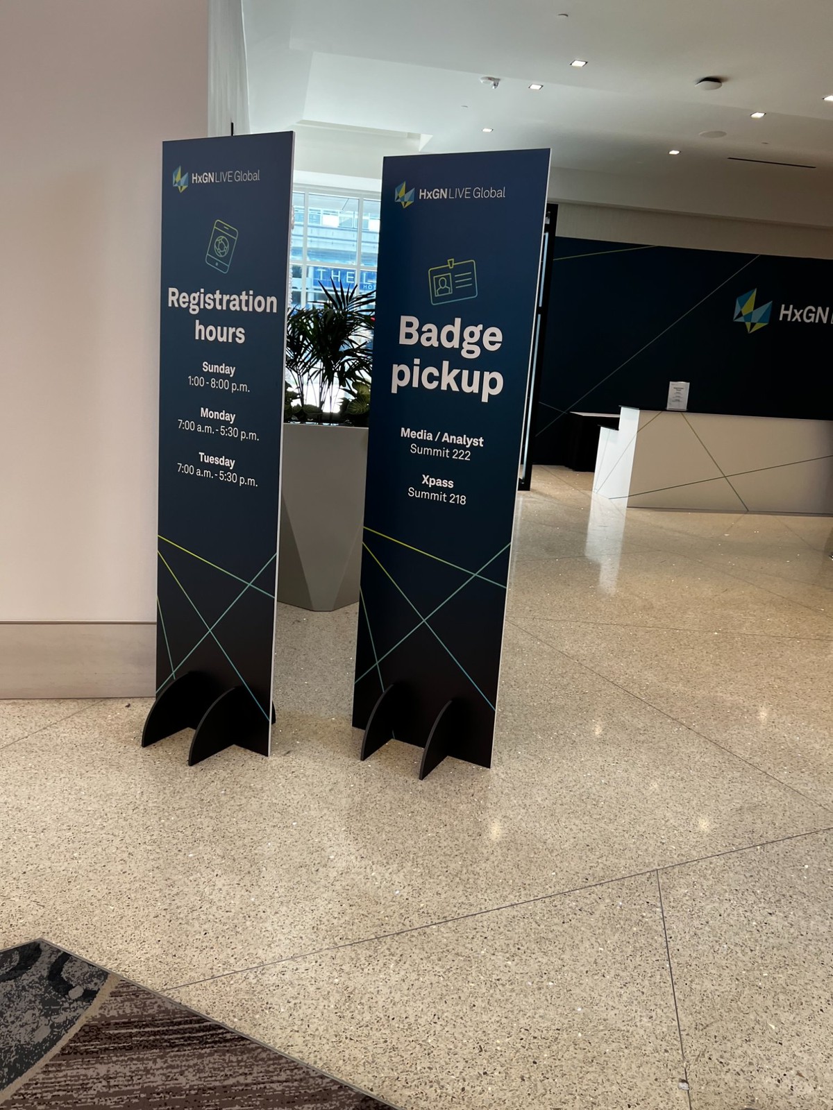 Badge pickup and registration signage